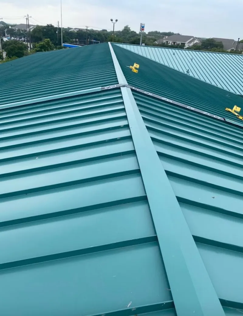 Green commercial metal roof ridge and valley for Metal Roof Repair in Mill Creek East