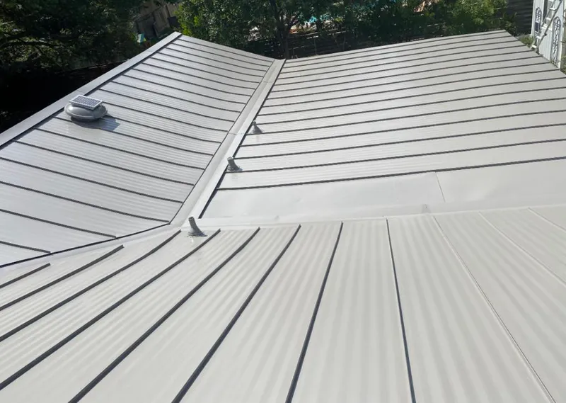 Solar attic fan installed on a metal roof for Roof Ventilation in Mill Creek East